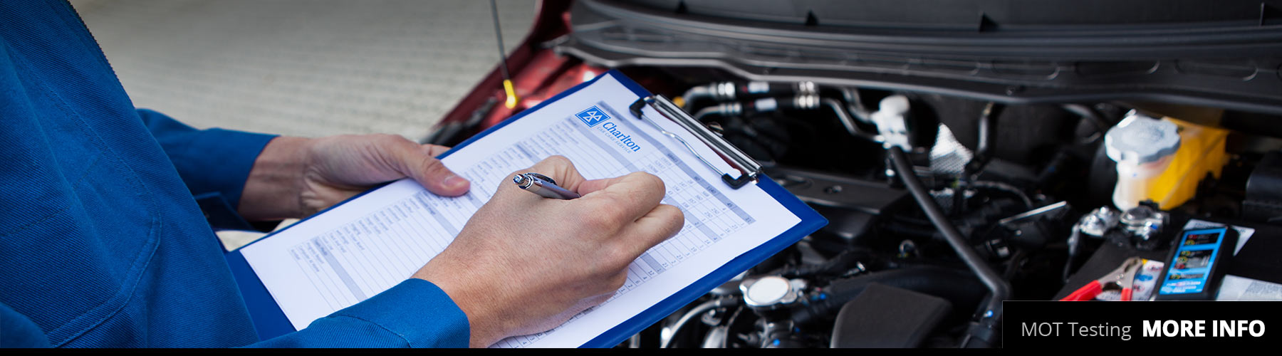 Man with clipboard checking off items to pass MOT Test